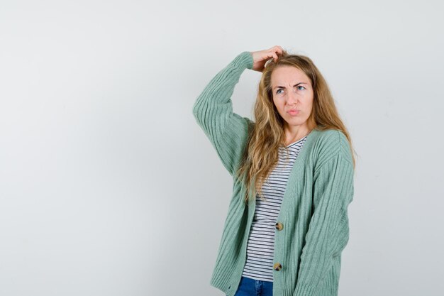 Expressive young woman posing in the studio