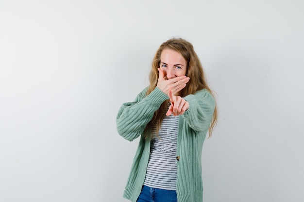 Expressive young woman posing in the studio