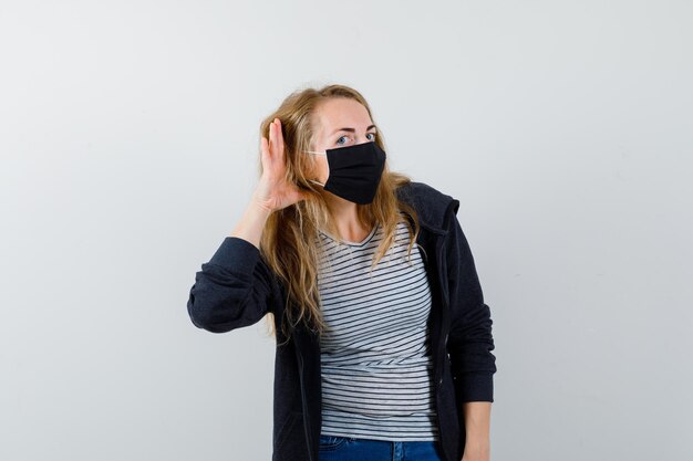 Expressive young woman posing in the studio