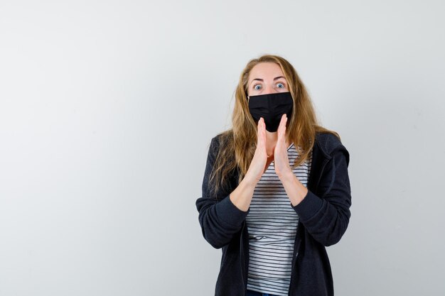 Expressive young woman posing in the studio