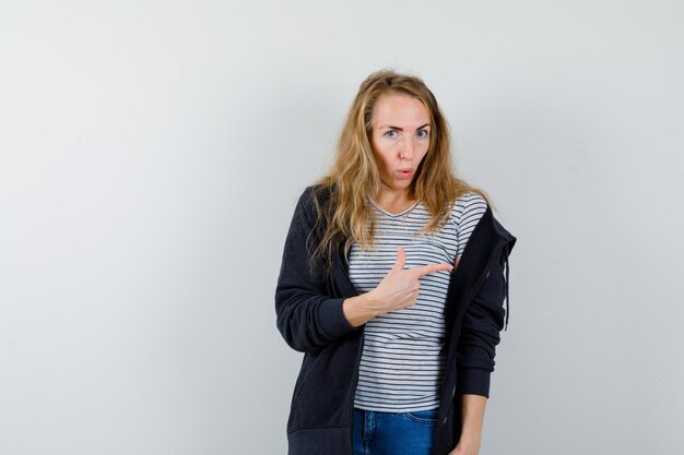 Expressive young woman posing in the studio