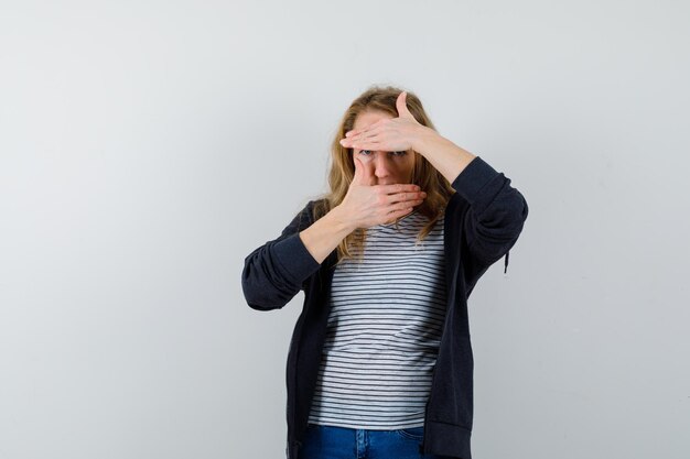 Expressive young woman posing in the studio