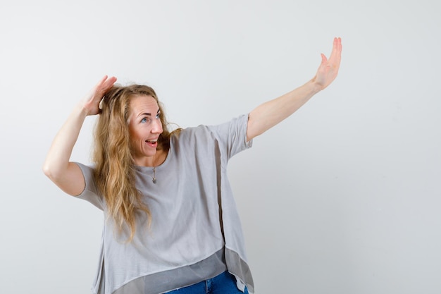 Expressive young woman posing in the studio