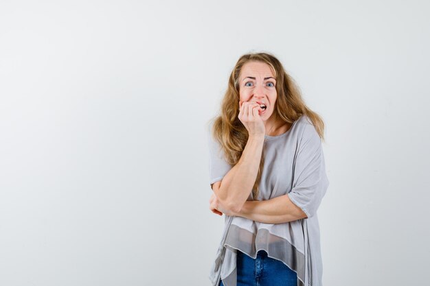 Expressive young woman posing in the studio