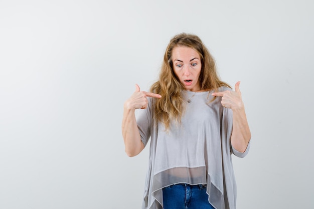 Expressive young woman posing in the studio