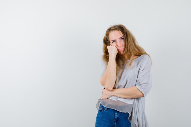 Expressive young woman posing in the studio