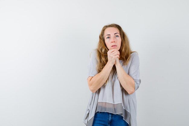 Expressive young woman posing in the studio