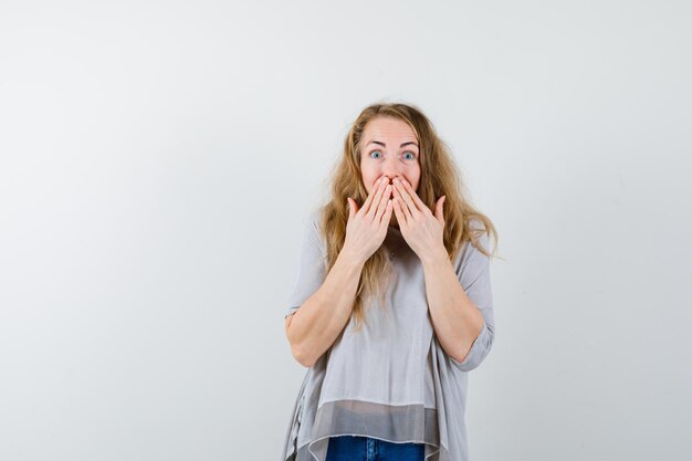 Expressive young woman posing in the studio