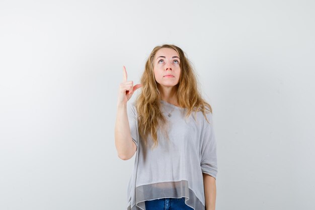 Expressive young woman posing in the studio