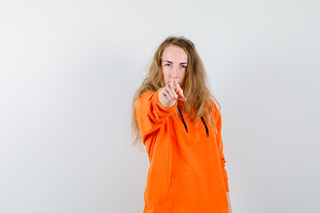 Expressive young woman posing in the studio