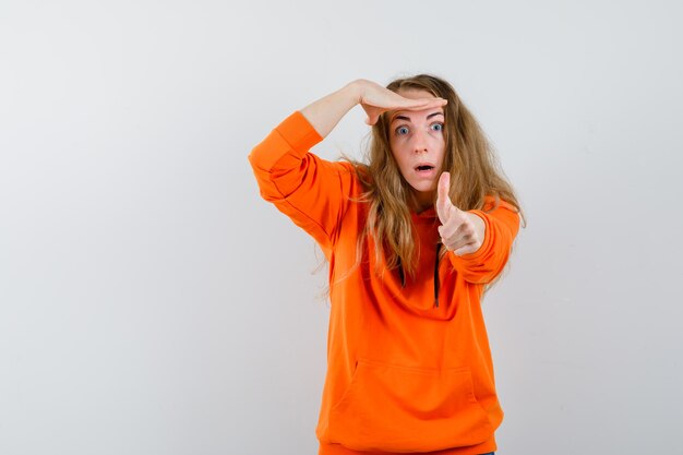 Expressive young woman posing in the studio