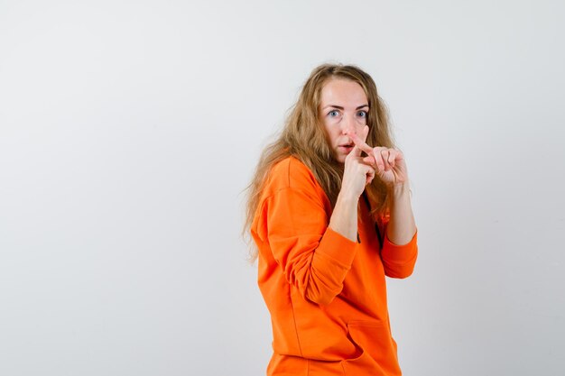 Expressive young woman posing in the studio