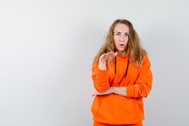 Expressive young woman posing in the studio