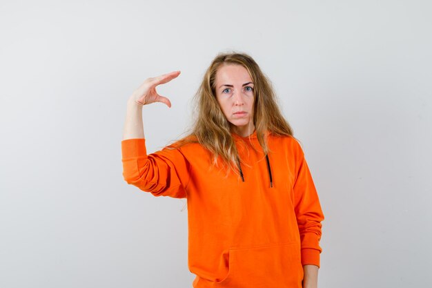 Expressive young woman posing in the studio