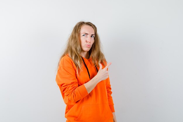 Expressive young woman posing in the studio