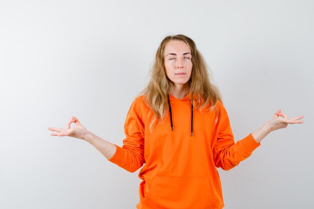 Expressive young woman posing in the studio