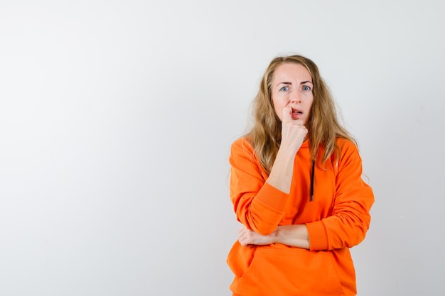 Expressive young woman posing in the studio