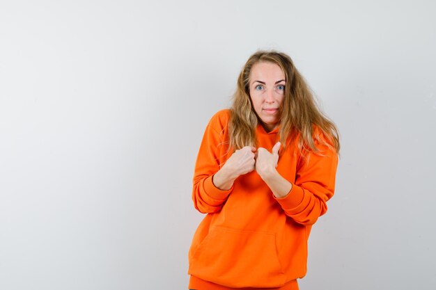 Expressive young woman posing in the studio