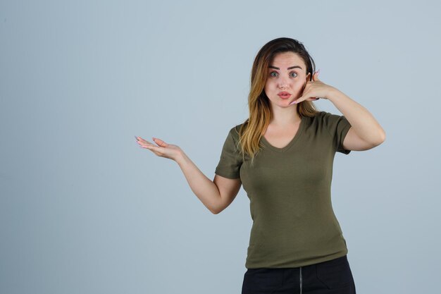 Expressive young woman posing in the studio