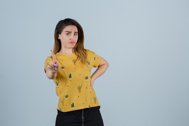 Expressive young woman posing in the studio