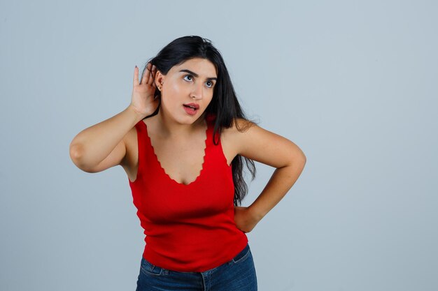 Expressive young woman posing in the studio