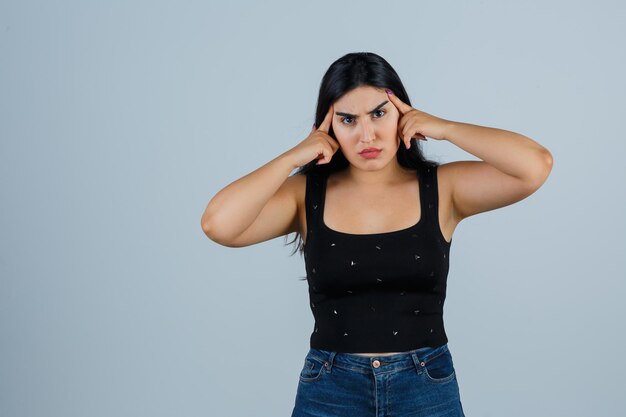 Expressive young woman posing in the studio