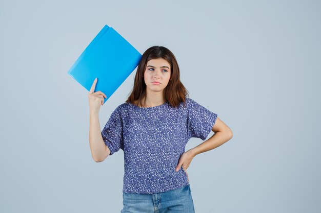 Expressive young woman posing in the studio