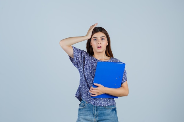 Expressive young woman posing in the studio