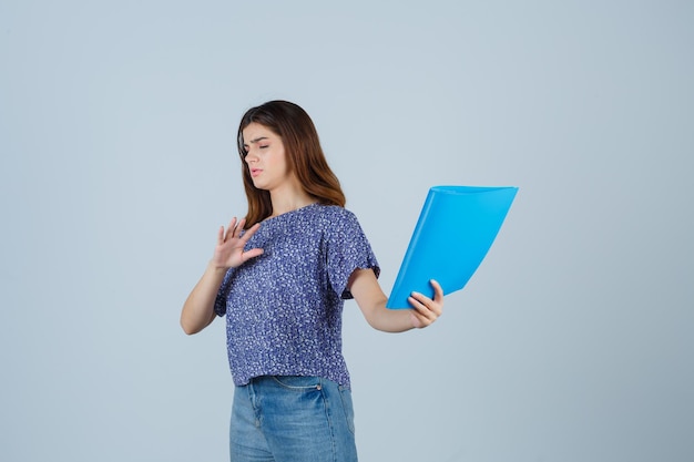 Expressive young woman posing in the studio