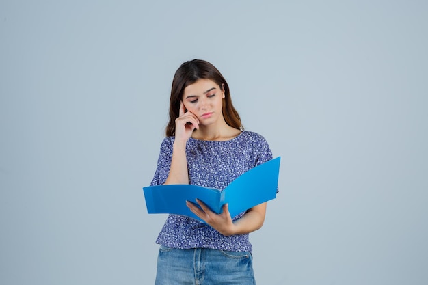 Expressive young woman posing in the studio