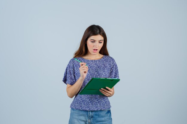 Expressive young woman posing in the studio