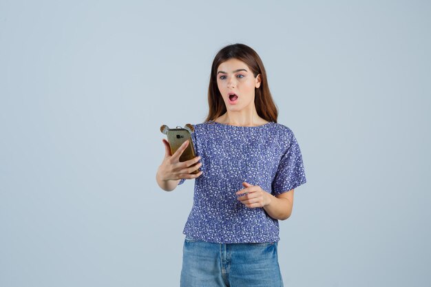 Expressive young woman posing in the studio