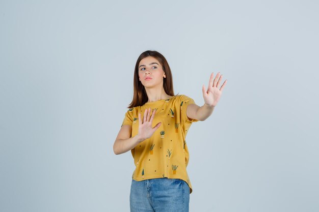 Expressive young woman posing in the studio