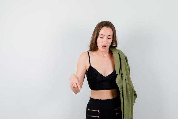 Expressive young woman posing in the studio