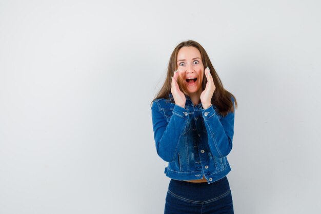 Expressive young woman posing in the studio