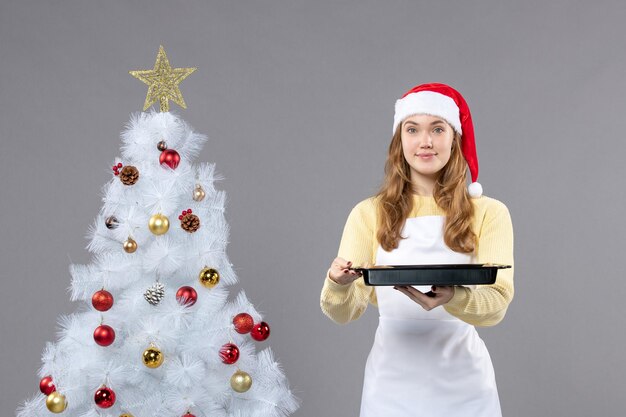 Expressive young woman posing for winter holidays