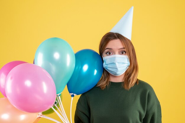 Expressive young woman posing with a face mask