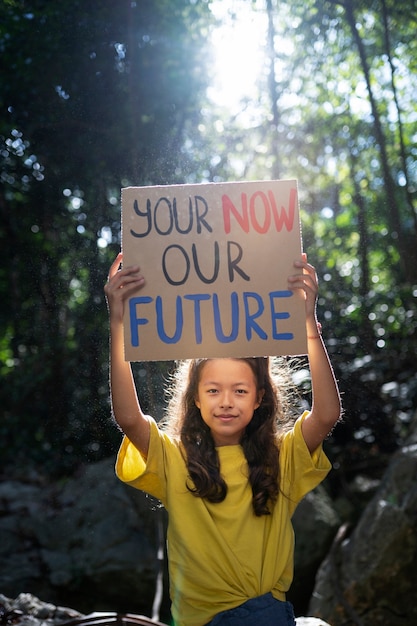 Free photo exterior portrait of kid for world environment day