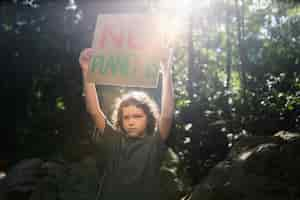 Free photo exterior portrait of kid for world environment day