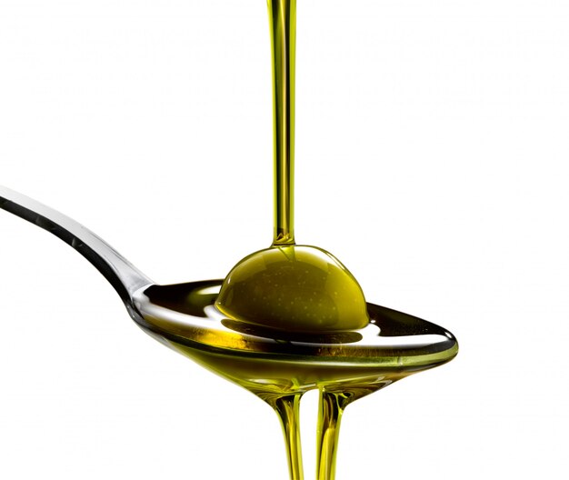 Premium Photo Olive oil poured into a spoon in all its forms