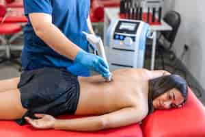 Free photo extracorporeal shockwave therapy physical therapy for neck and back muscles
