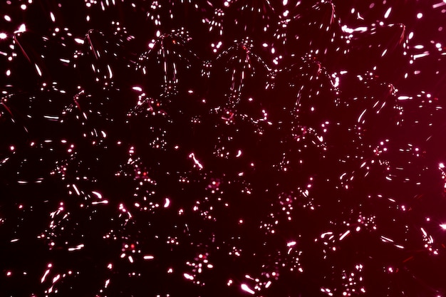 Extreme close-up ferromagnetic metal  constellation on burgundy shades