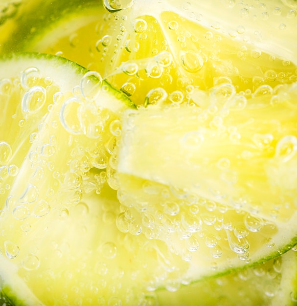 Extreme close-up lime slices underwater