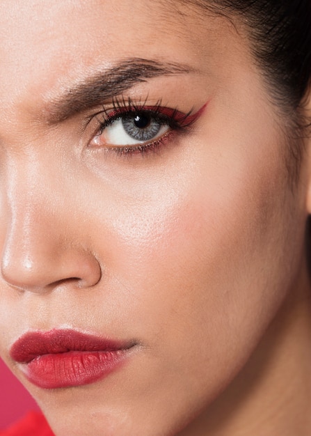 Extreme close-up shot serious model wearing make-up