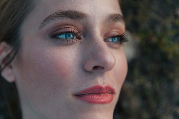 Free photo extreme close up shot woman looking upwards