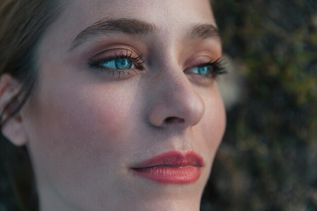 Extreme close up shot woman looking upwards