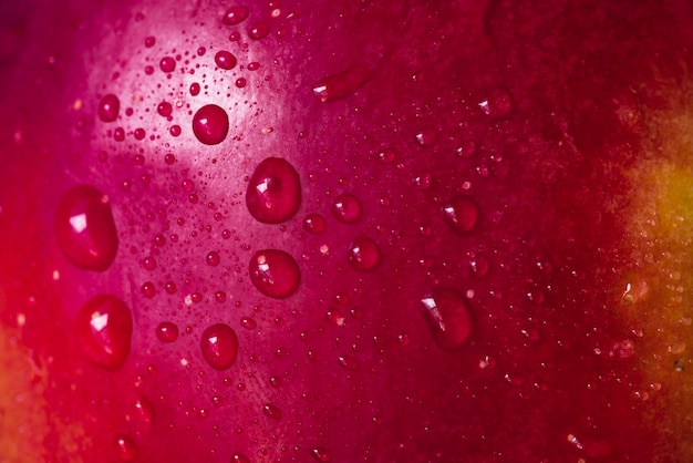Extreme close-up water on red apple
