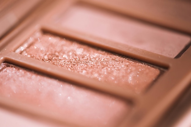 Eye shadows with glitter in pink shade closeup. selective focus.