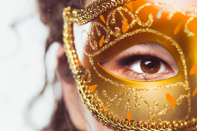 Free photo eye of woman in beautiful mask