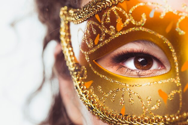 Eye of woman in beautiful mask